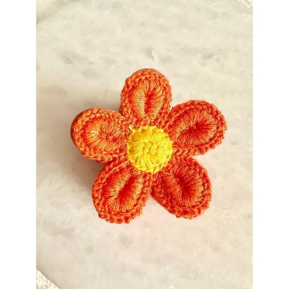 Orange and yellow crochet flower hair claw ￼